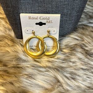 Beautiful pair of hoop earrings. Rose gold in color.​​